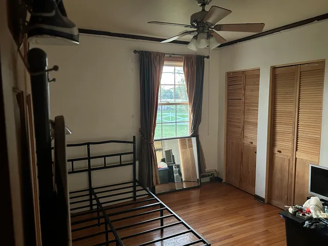 a view of a room with wooden walls