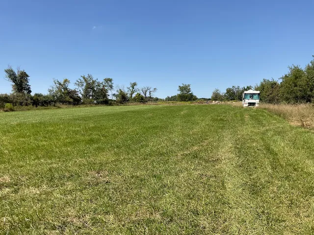 a view of a golf course with green space