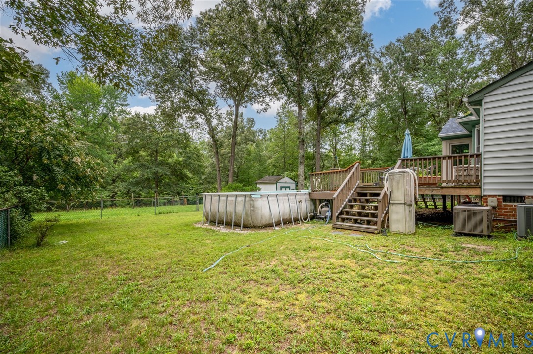 17707 Loving Union Road Disputanta, VA 23842 - Photo 33 of 42 Expansive backyard featuring a large wood deck wit