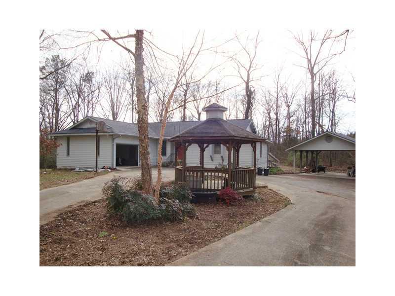 164 Corinth Road Northeast Calhoun, GA 30701 - Photo 1 of 1 Exterior Front. Lovely single story ranch with gazebo on large, wooded acreage.