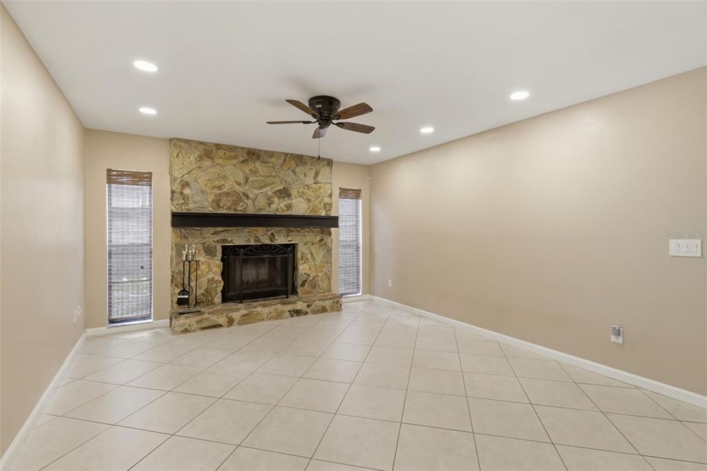 302 Bloomingfield Drive Brandon, FL 33511 - Photo 19 of 58 a view of an empty room with a fireplace