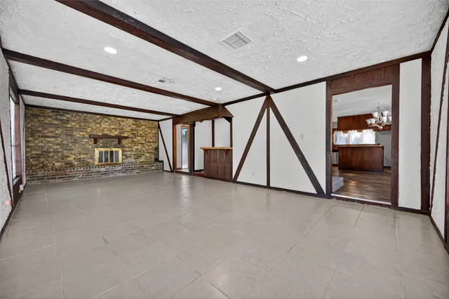 a view of an empty room with stairs