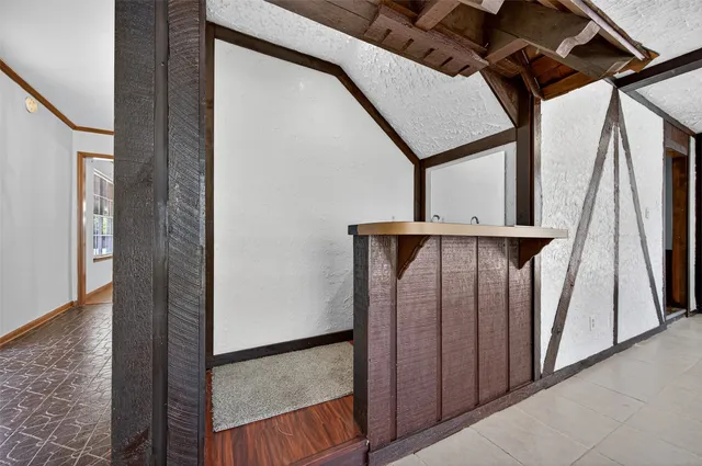 a bathroom with a granite countertop sink a mirror and a shower