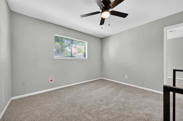 a view of a livingroom with a ceiling fan