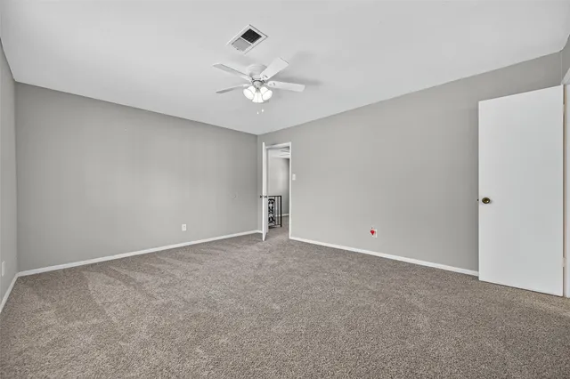 a bathroom with a double vanity sink a toilet and a mirror