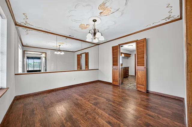 a view of livingroom with hardwood floor and hallway