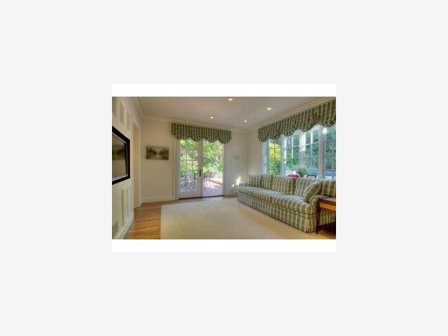 238 Harvard Road San Mateo, CA 94402 - Photo 6 of 9 a living room with a couch and chandelier