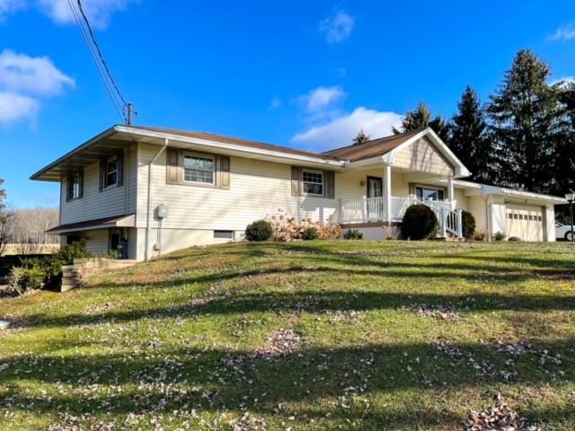 8243 Lamor Road Mercer, PA 16137 - Photo 2 of 25 a front view of a house with a garden