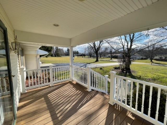 8243 Lamor Road Mercer, PA 16137 - Photo 4 of 25 a view of a porch with wooden floor and fence