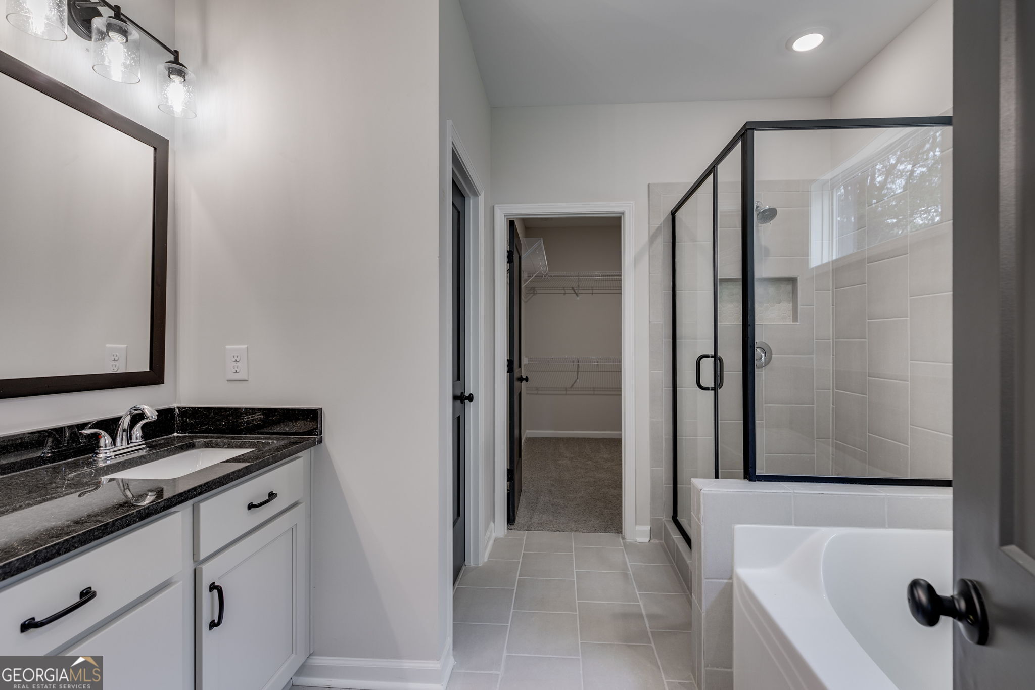 10 Avery Road Roopville, GA 30170 - Photo 31 of 46 a bathroom with a granite countertop sink and a mirror