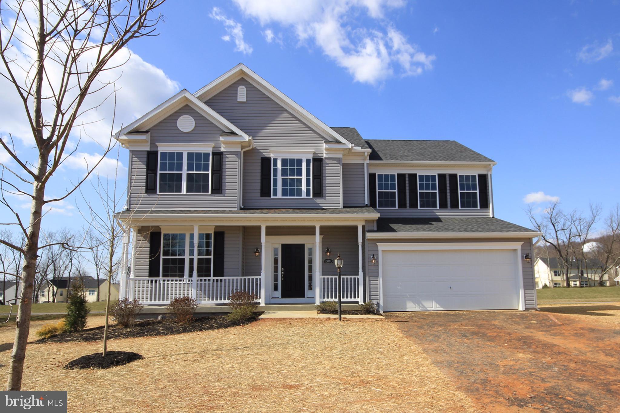 5325 Renn Road Frederick, MD 21703 - Photo 2 of 2 a front view of a house with a yard