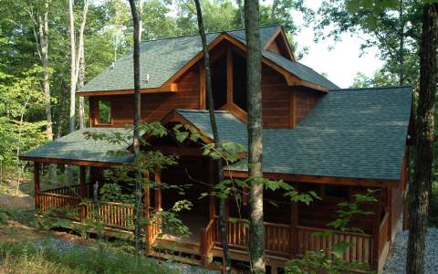 63 Wolf Trace Blue Ridge, GA 30513 - Photo 1 of 1 a view of a house with backyard and sitting area