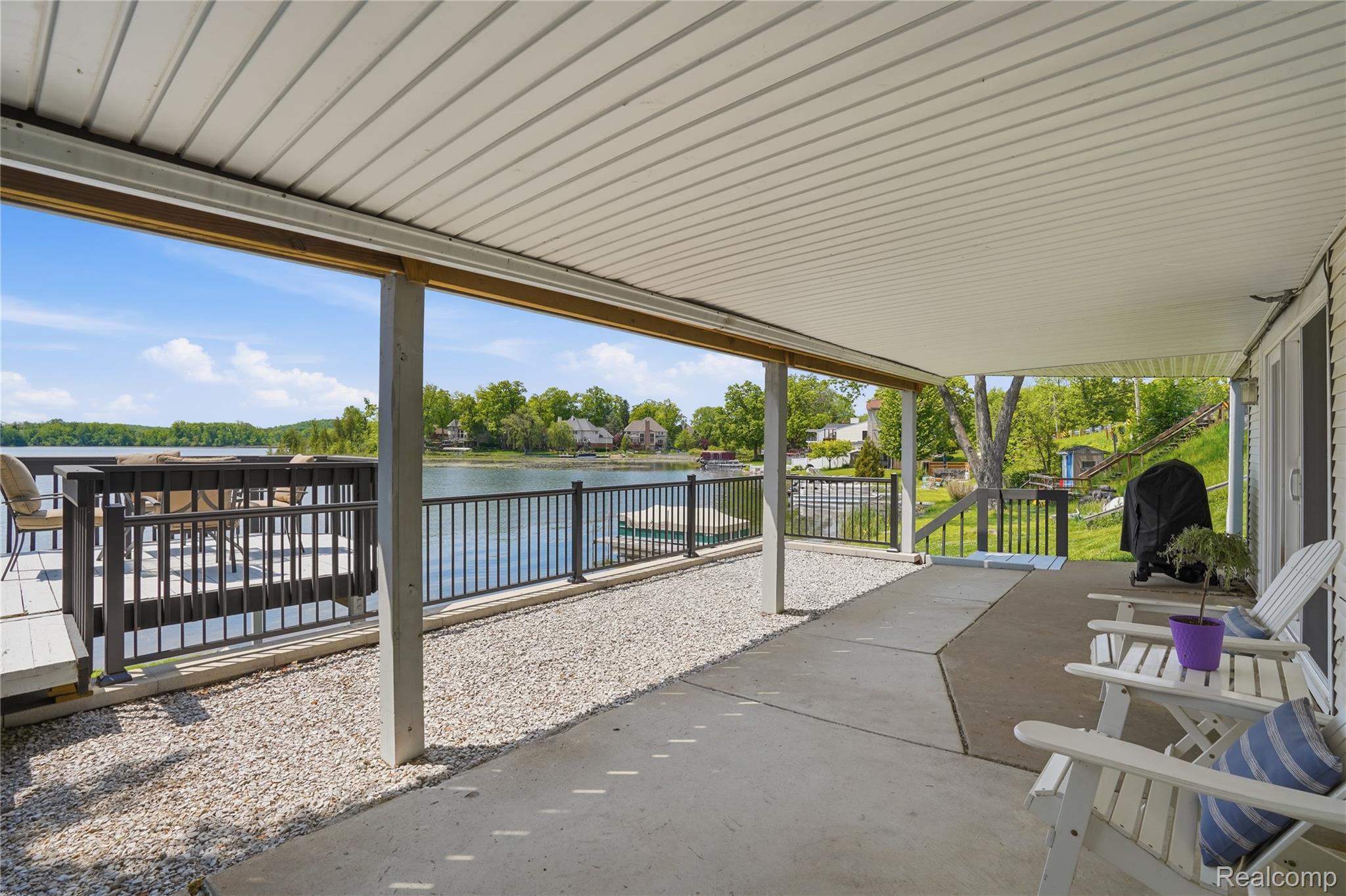 7217 Andersonville Road Clarkston, MI 48346 - Photo 46 of 65 Covered patio featuring a concrete surface, gravel hardscaping, and a white paneled ceiling