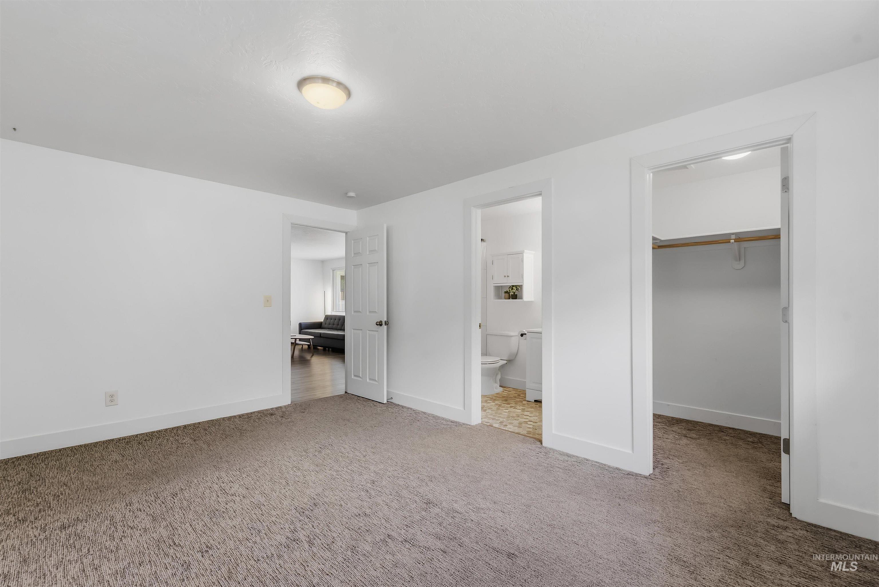 355 East Beacon Light Road Eagle, ID 83616 - Photo 14 of 47 Carpeted room featuring white walls and a flush-mount ceiling light