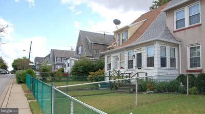 40 Kinship Road Baltimore, MD 21222 - Photo 2 of 2 a front view of a house with a garden and lake view