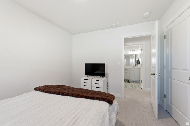1038 South Old Towne Road Layton, UT 84041 - Photo 23 of 39 Bedroom space featuring light-toned carpeting and a door opening to a bathroom