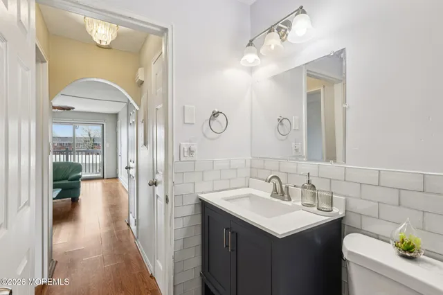 a bathroom with a sink vanity and a mirror