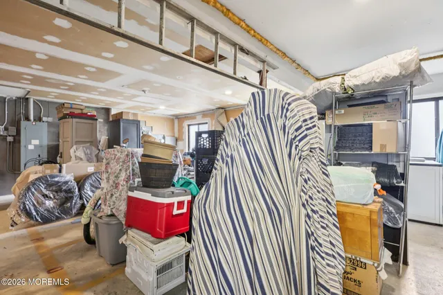a living room with lots of furniture and a chandelier