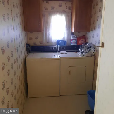 a room with a sink and a mirror