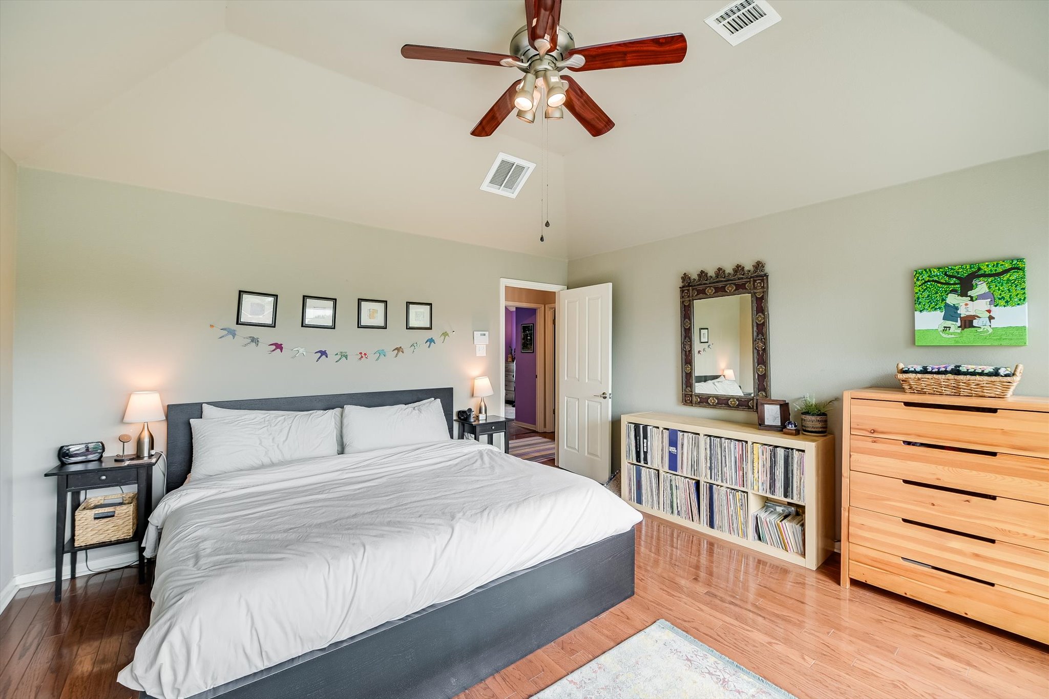 6456 Ruxton Lane Austin, TX 78749 - Photo 17 of 30 A comfortable bedroom features rich wood flooring, a soaring vaulted ceiling, and an inviting ambiance.