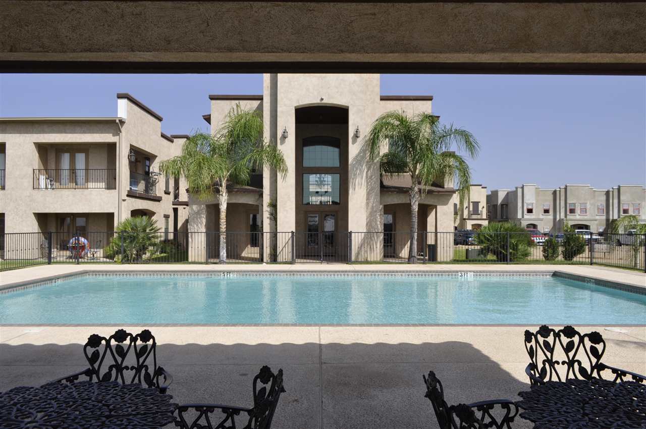 8216 Casa Verde Road, Unit E158 Laredo, TX 78041 - Photo 16 of 20 a view of a chairs and table in a balcony