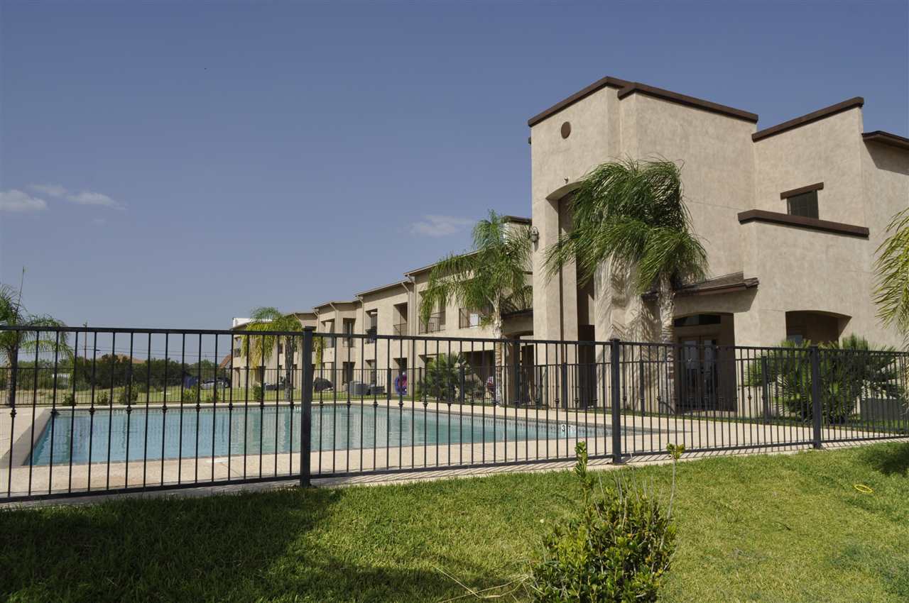 8216 Casa Verde Road, Unit E158 Laredo, TX 78041 - Photo 17 of 20 a view of a house with a small yard and a large window