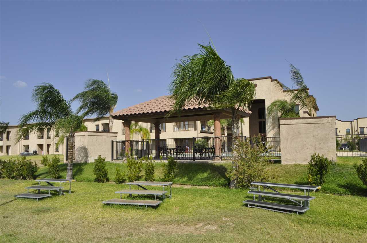 8216 Casa Verde Road, Unit E158 Laredo, TX 78041 - Photo 20 of 20 a front view of a house with a garden