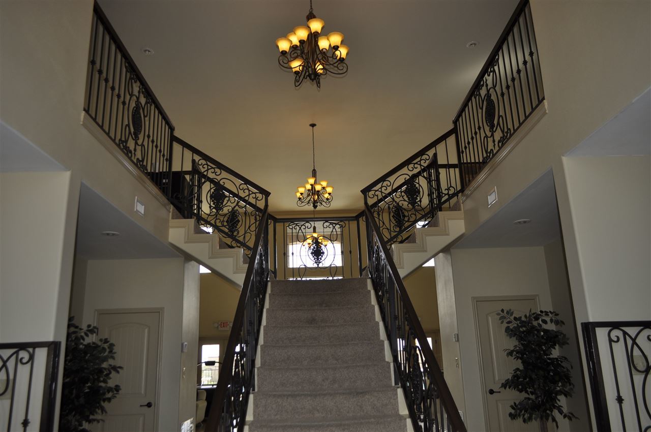 8216 Casa Verde Road, Unit E158 Laredo, TX 78041 - Photo 10 of 20 a view of entryway and hall with a chandelier