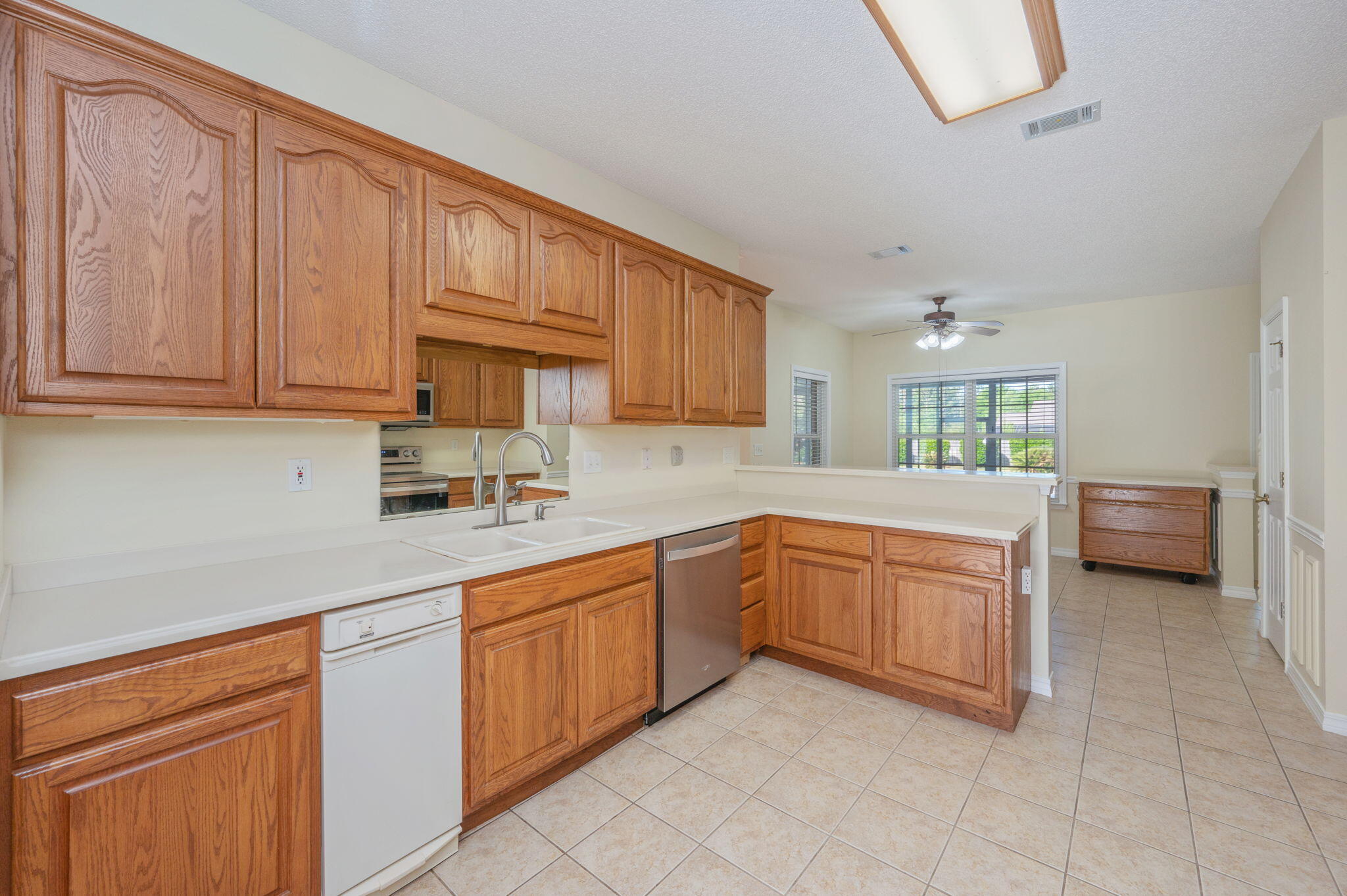 5552 Frontier Drive Crestview, FL 32536 - Photo 18 of 50 a kitchen with sink cabinets and window