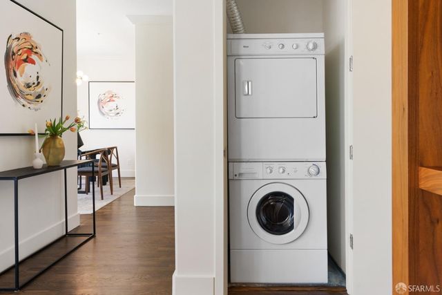 a view of a hallway with washer and dryer