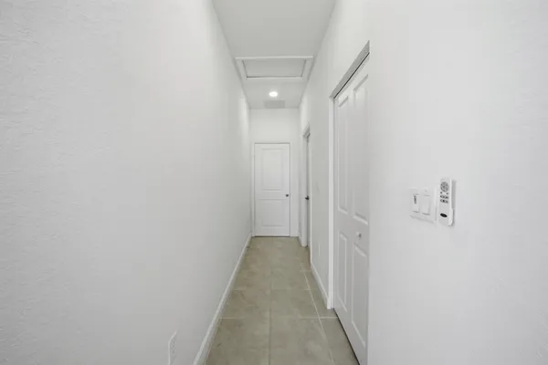 a view of walk in closet with clothes