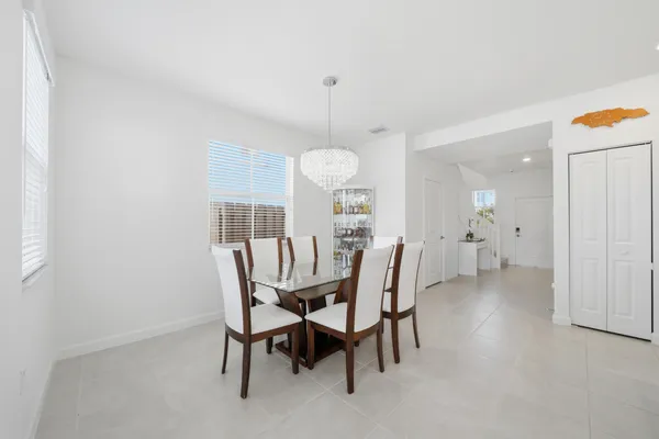 a dining room with furniture and window