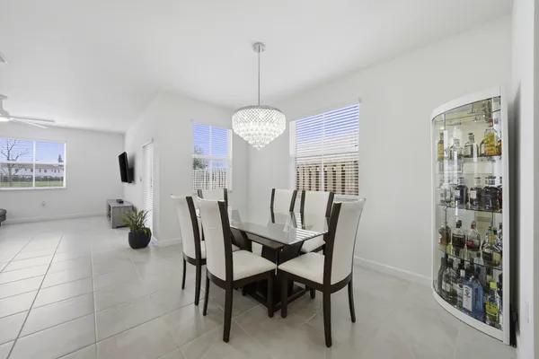 a dining room with furniture and window