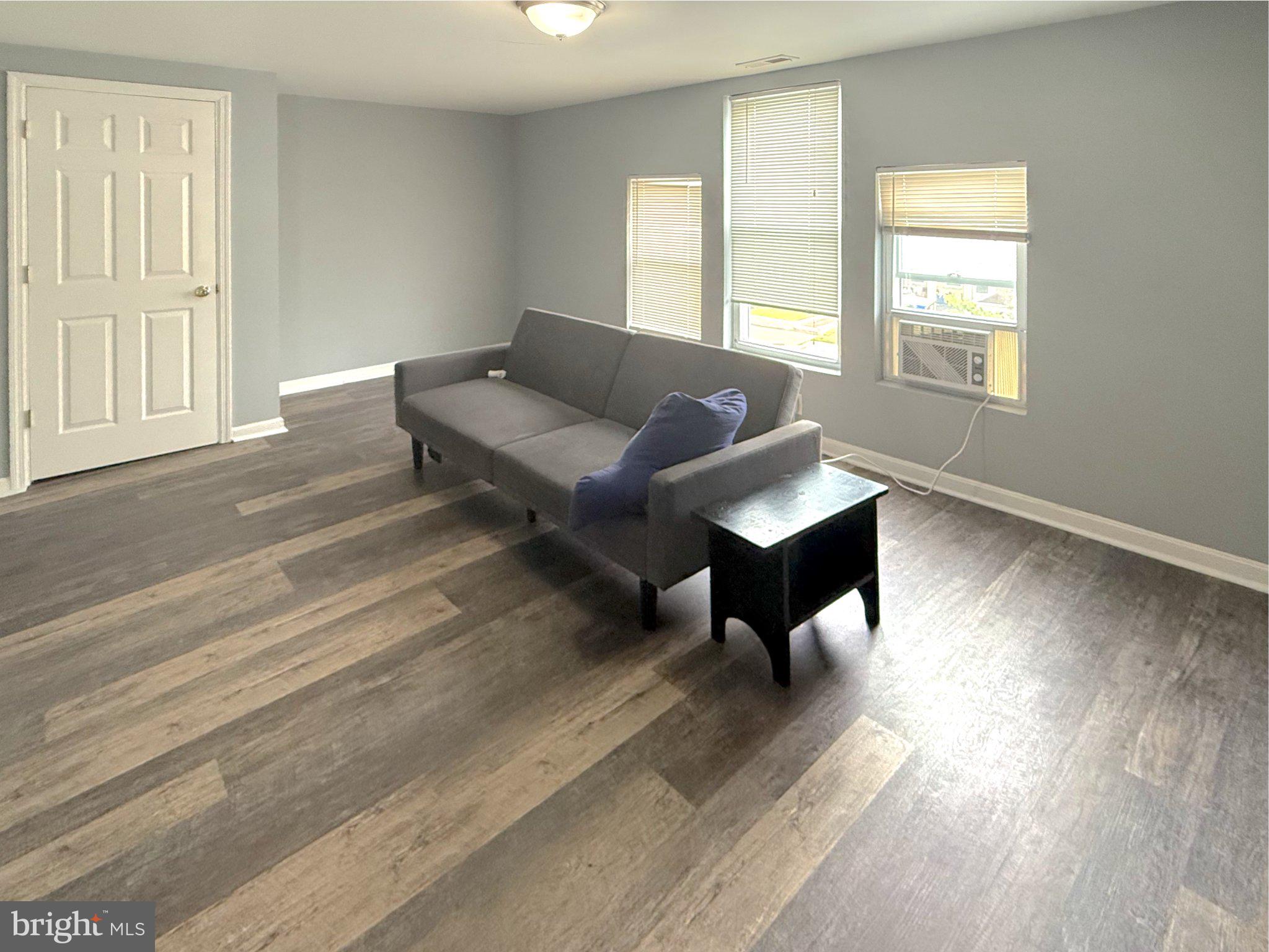 304 Collins Avenue, Unit 2 Baltimore, MD 21229 - Photo 6 of 17 Bright and airy living space awaits.