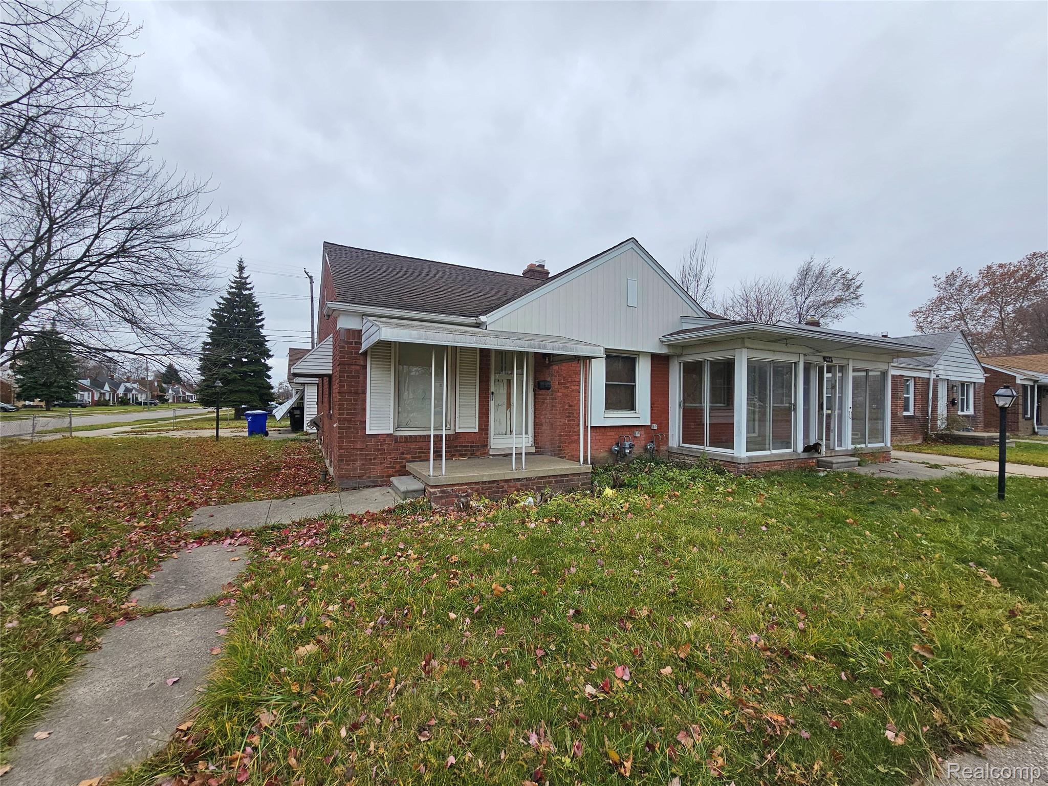 19442 Moross Road Detroit, MI 48224 - Photo 1 of 48 Bungalow-style house with a front lawn, brick siding, and covered porch