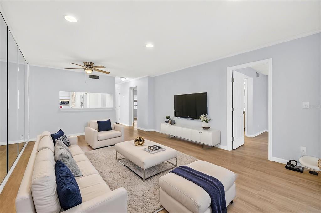 5197 Silent Loop, Unit 124 New Port Richey, FL 34652 - Photo 19 of 55 a living room with furniture and a flat screen tv