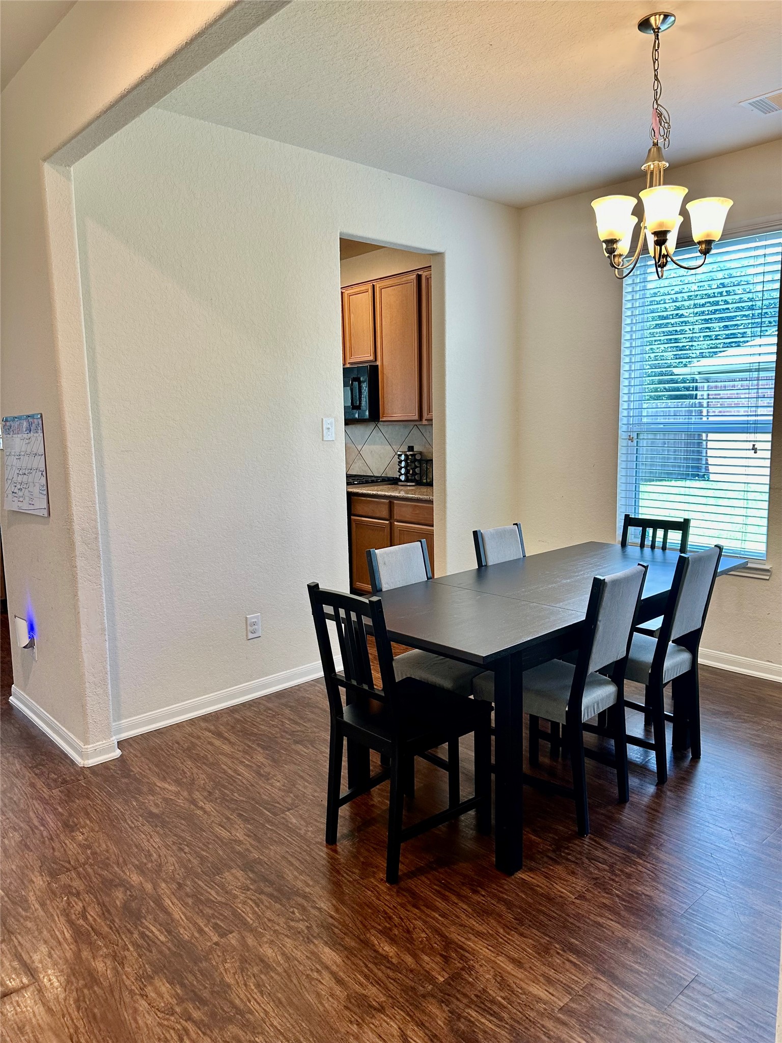 18622 Each Elm Way Houston, TX 77084 - Photo 8 of 35 a view of a dining room with furniture window and wooden floor