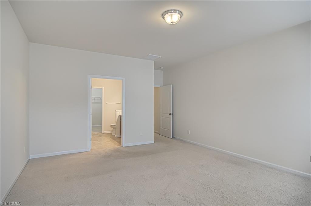 588 Forage Drive High Point, NC 27265 - Photo 16 of 33 Good sized primary bedroom features ensuite full bathroom and a walk-in closet!