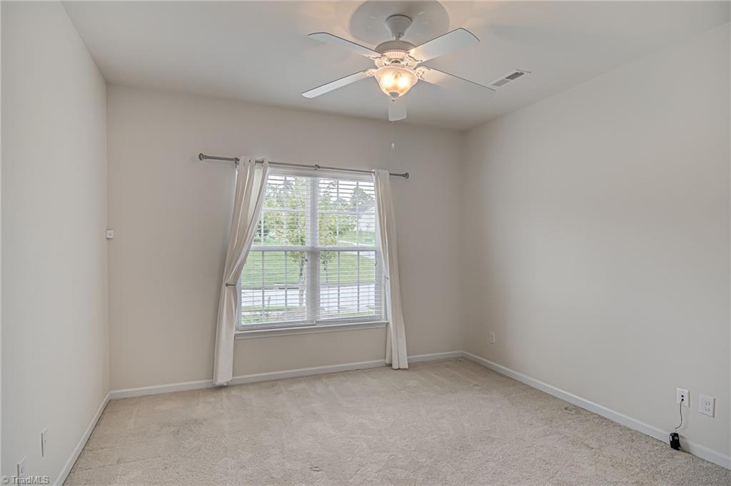 588 Forage Drive High Point, NC 27265 - Photo 20 of 33 Good sized second bedroom features large window, ceiling fan, and double door closet.