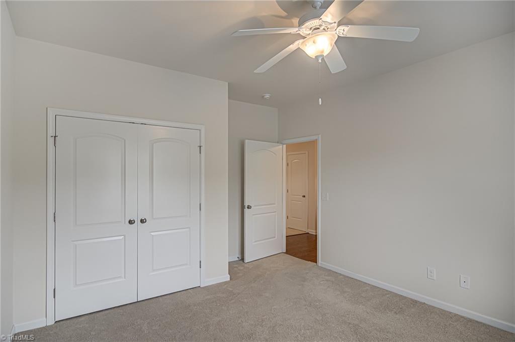 588 Forage Drive High Point, NC 27265 - Photo 21 of 33 Alternate view of second bedroom showing closet and foyer.