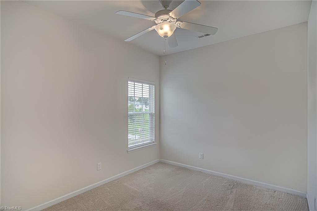 588 Forage Drive High Point, NC 27265 - Photo 22 of 33 Third bedroom features large window, ceiling fan, and double door closet