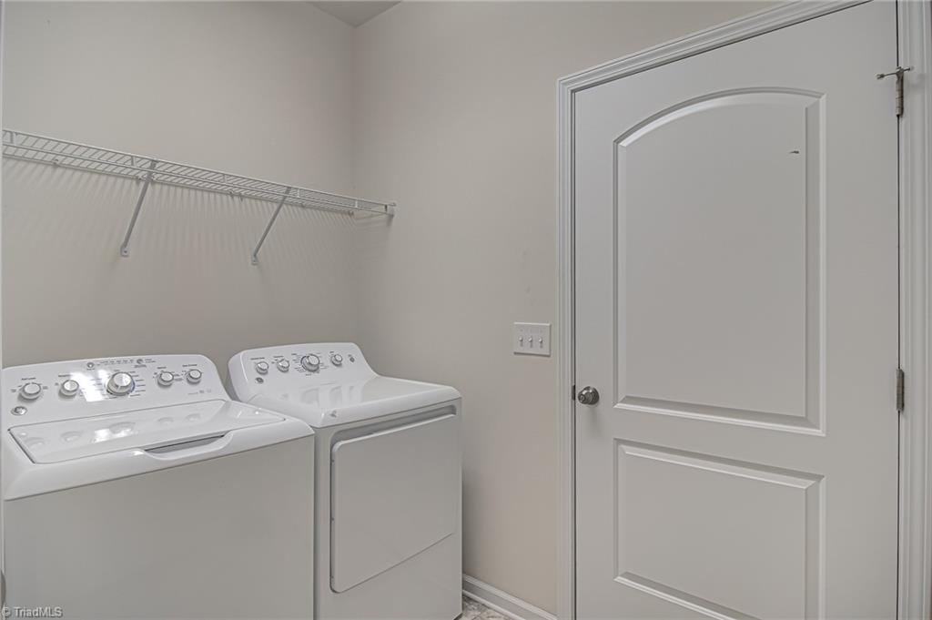 588 Forage Drive High Point, NC 27265 - Photo 25 of 33 Good size laundry room accessible from kitchen hallway and garage.