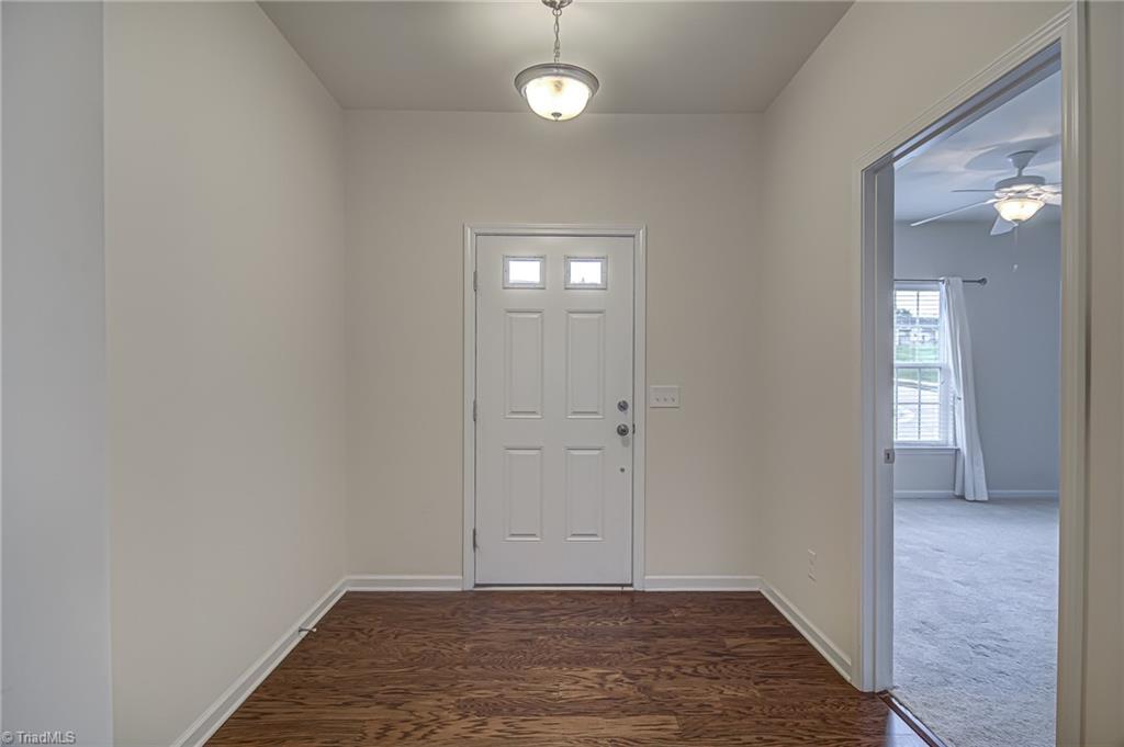 588 Forage Drive High Point, NC 27265 - Photo 4 of 33 From front door, you enter the foyer with wood floors. Doorway to the right leads to second bedroom.