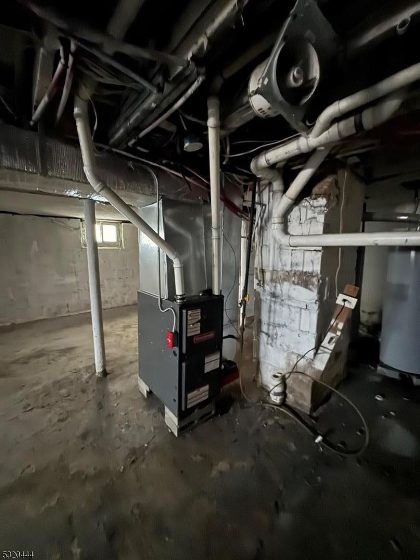 285 Wainwright Street Newark, NJ 07112 - Photo 23 of 27 a view of an empty room with wooden walls