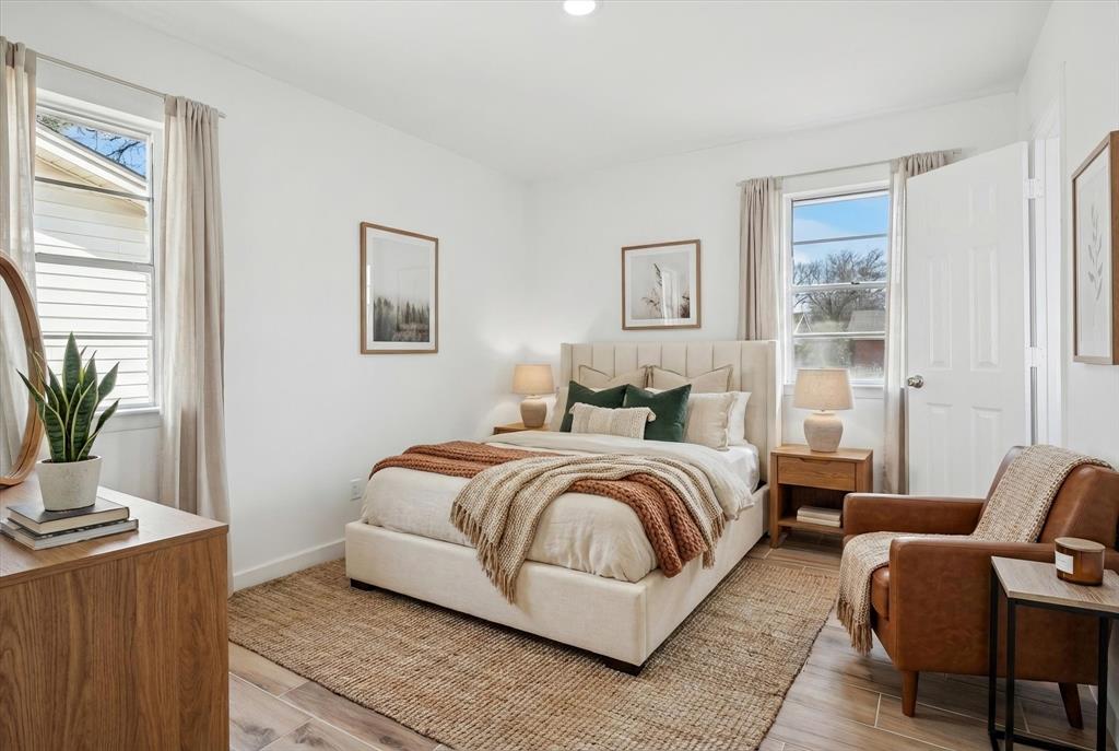 a spacious bedroom with a bed and a couch