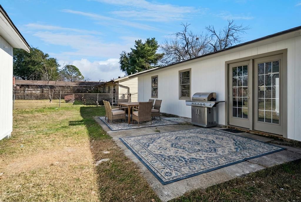 1809 Dunning Street Irving, TX 75061 - Photo 12 of 35 a view of a backyard with plants and a patio