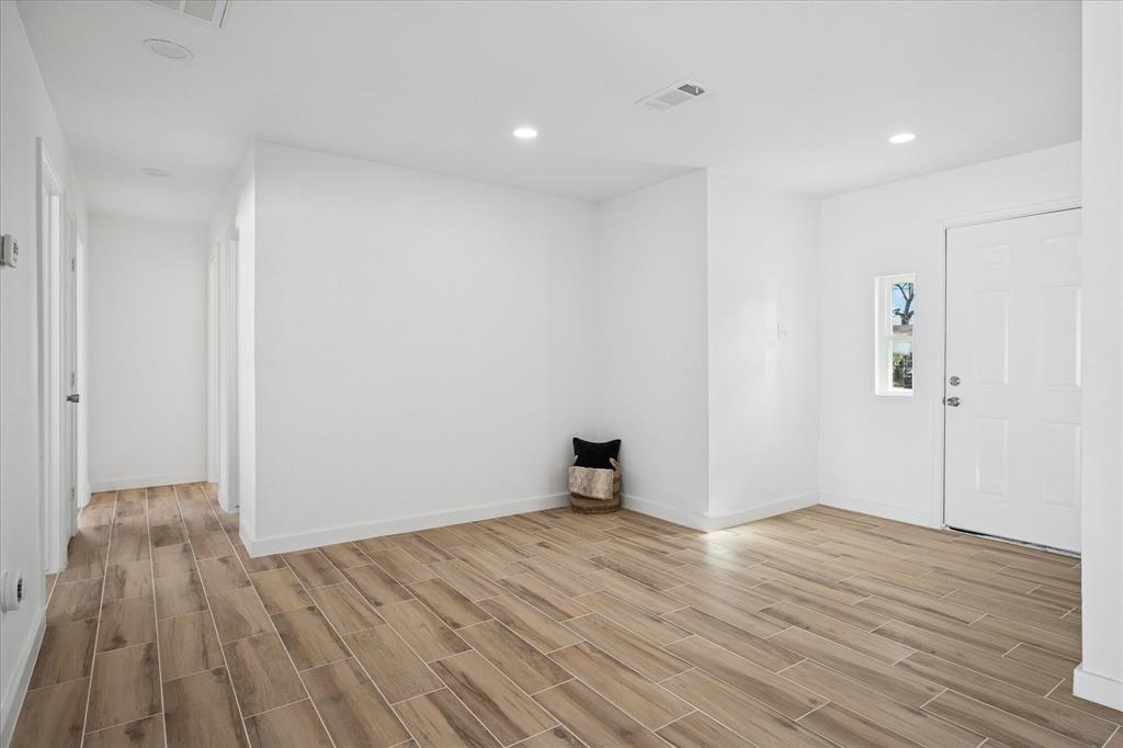 1809 Dunning Street Irving, TX 75061 - Photo 13 of 35 a view of an empty room with wooden floor