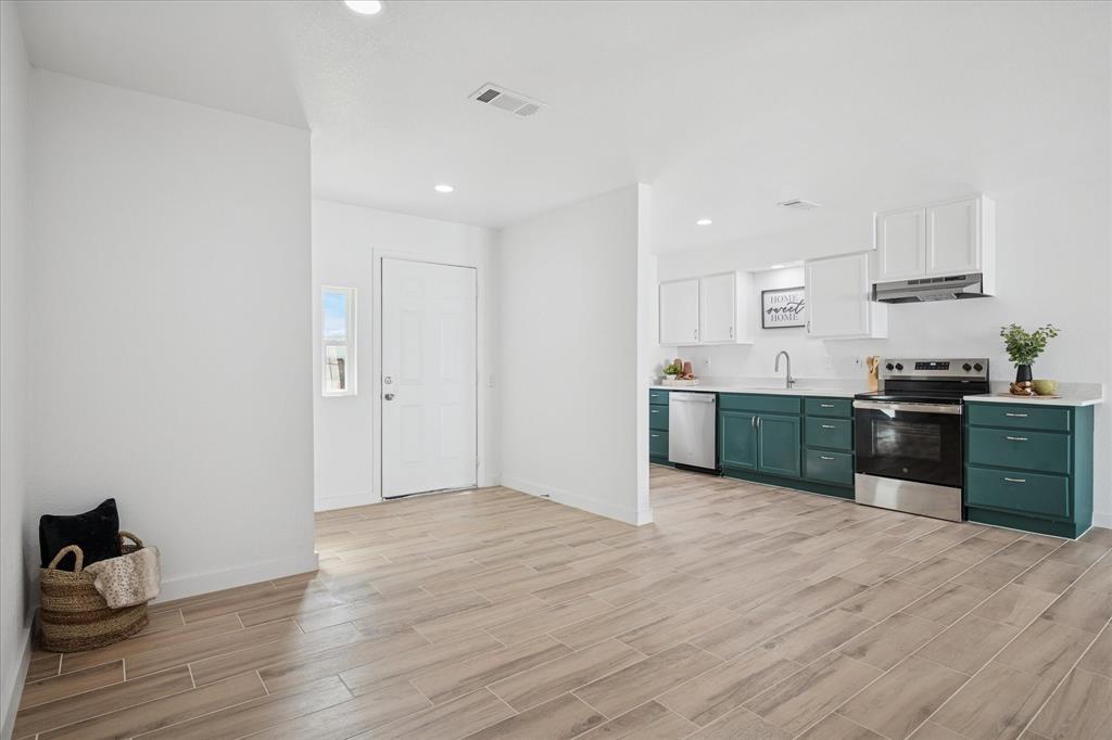 1809 Dunning Street Irving, TX 75061 - Photo 15 of 35 a view of kitchen with wooden floor