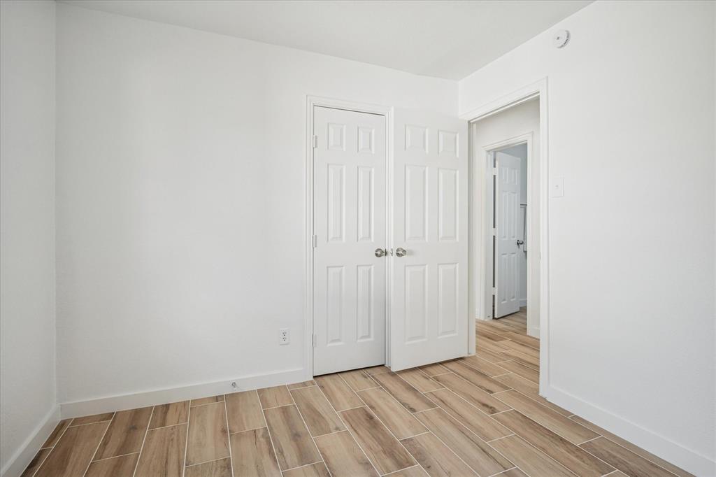1809 Dunning Street Irving, TX 75061 - Photo 25 of 35 a view of an empty room with wooden floor
