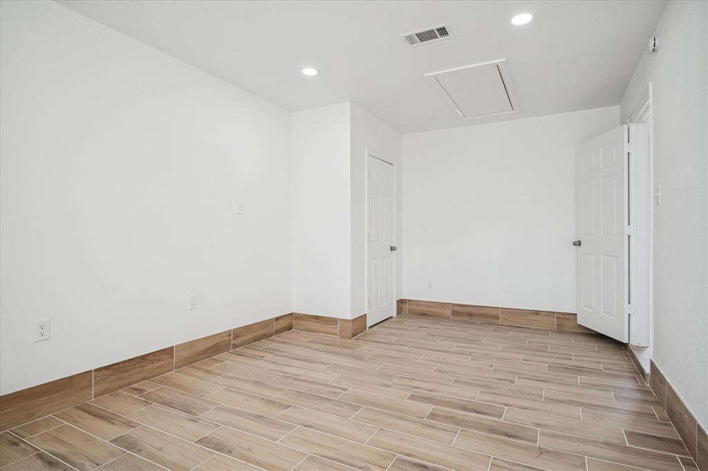 1809 Dunning Street Irving, TX 75061 - Photo 27 of 35 a view of room with wooden floor
